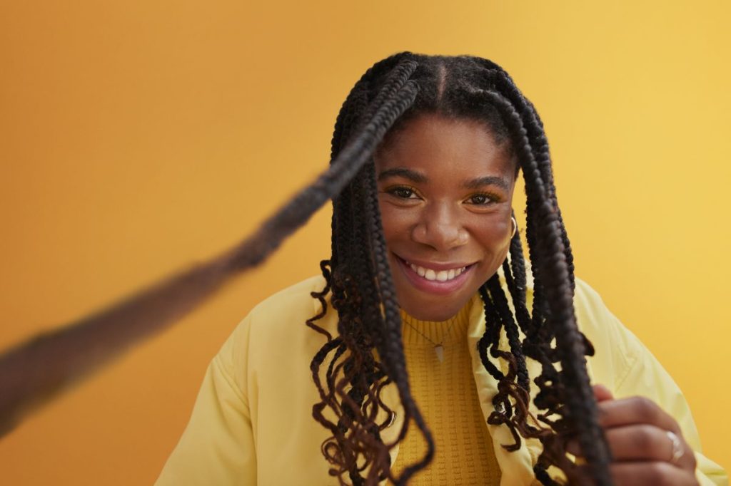 Women showcasing twist hairstyle