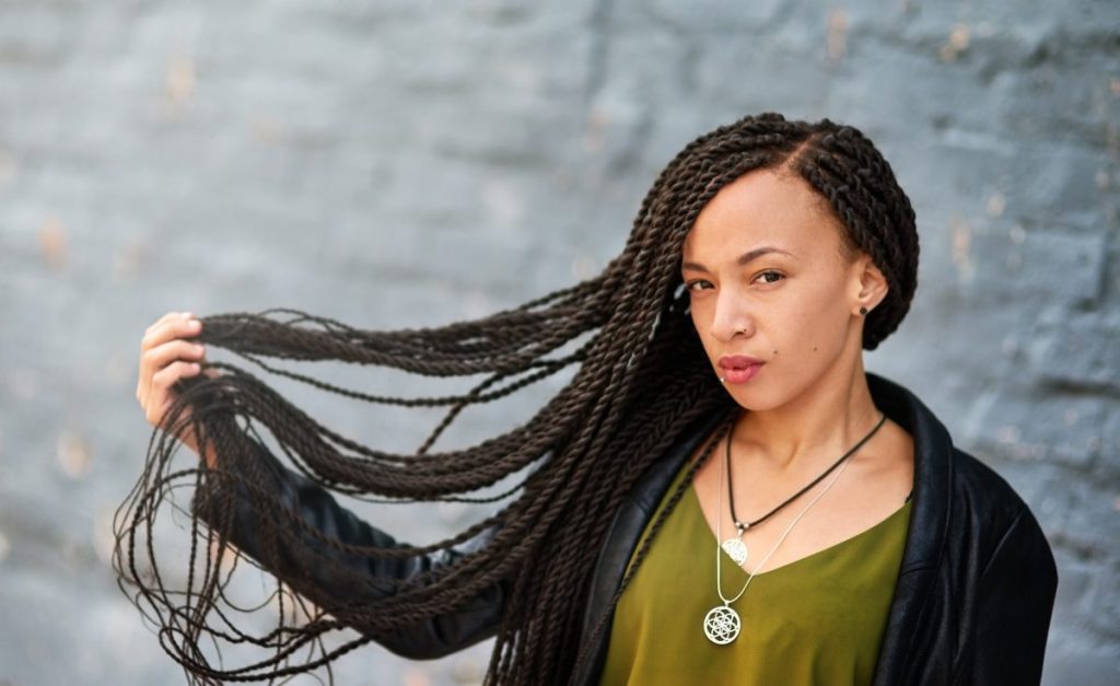 Woman sporting Senegalese twist braid hairstyle