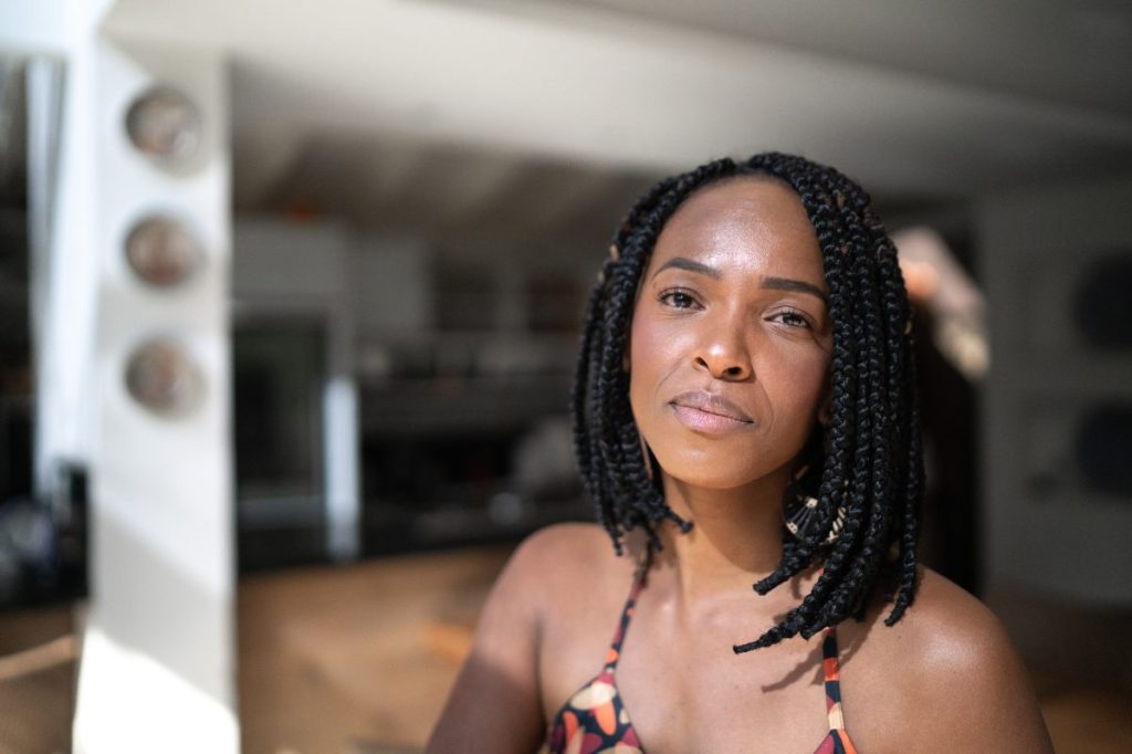 Woman sporting a short and sleek twist braid hairstyle