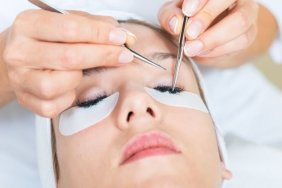 Woman getting eyelash extensions