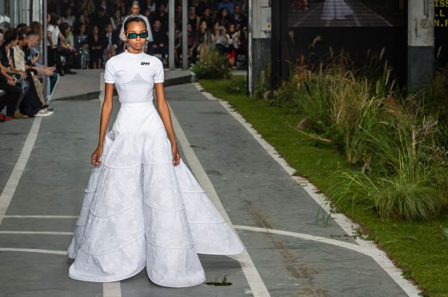 A model walks the racetrack-turned-runway at Off-White Spring 2019.